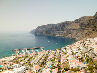 Tenerife, Los Gigantes a town on the Atlantic Ocean. Sunny coast and port city. Ocean, water, waves, blue ocean.