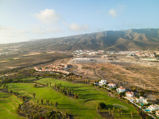 Tenerife, a town on the Atlantic Ocean. Sunny coast and dry soil. Ocean, water, waves, blue ocean.