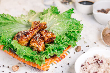 Roasted chicken thighs on a green salad 