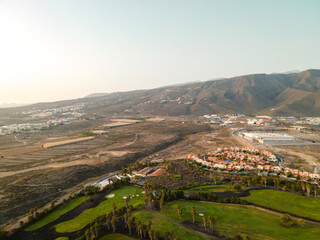 Tenerife, a town on the Atlantic Ocean. Sunny coast and dry soil. Ocean, water, waves, blue ocean.