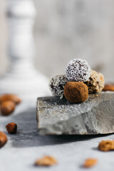 Different selection of dessert balls served on a rock
