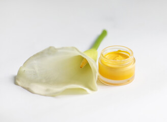 Cream in a jar on a white background