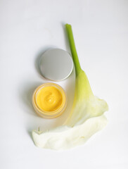 Cream in a jar on a white background