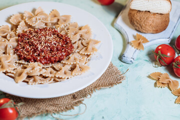 Pasta with bolognese sauce and grated cheese