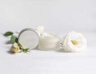 Cream in a jar on a white background