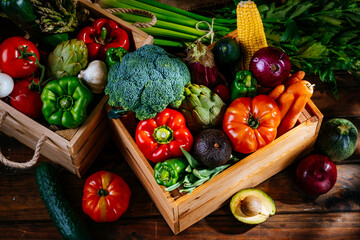 Top view of colorful fresh farm vegetables on a wooden table, balanced diet