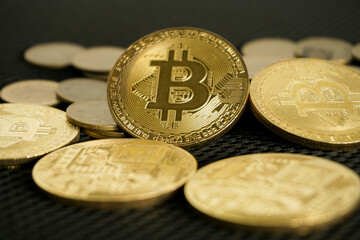 bitcoin on black background with selective focus