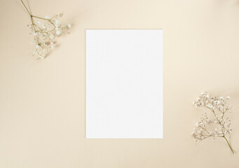 Wedding invitation card mockup with white gypsophila flowers
