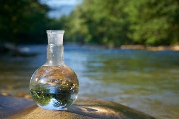 Flask with clear river water.