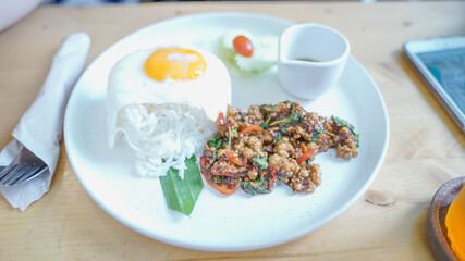 Rice topped with stir fried pork and basil.