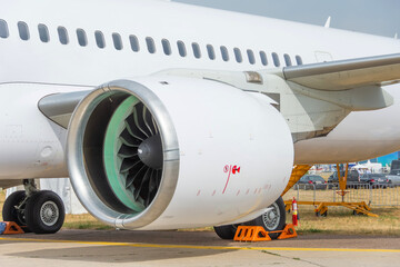New engine at the plane parked at the airport.