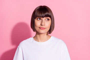 Fototapeta premium Portrait of charming bewildered girl wearing white tshirt overthinking copy space isolated over pink pastel color background
