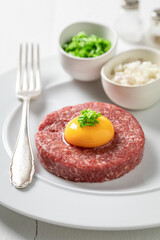 Spicy beef tartare with gherkin and chives. Full of protein.