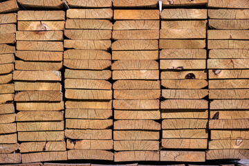 Lumber stacked and ready for construction site