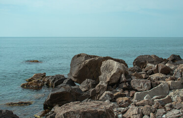 Fototapeta na wymiar stones on the sea coast in summer