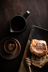 coffee with a bun on a dark background. High quality photo