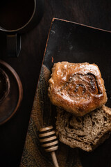 coffee with a bun on a dark background. High quality photo