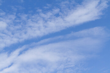 White clouds in blue sky on sunny summer day at countryside