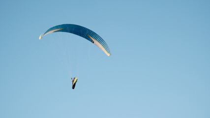 Paragliders against the blue sky. Air sports. Active rest outside the city