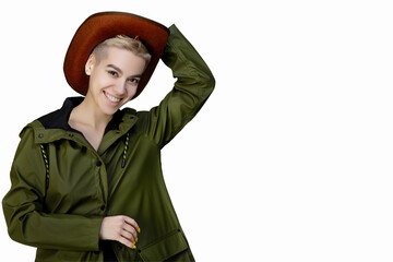 Fototapeta premium girl in a green jacket with a cap on her head. isolated