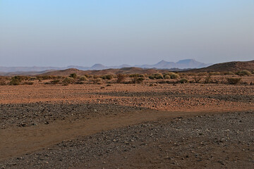 incredible view of flat desert landscape in namibia during blue hour