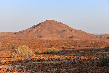 stunning red landscape in the semi desert of namibia, blue sky