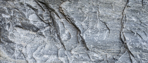 Texture and pattern of natural gray-black stone wall