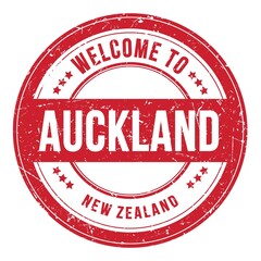 WELCOME TO AUCKLAND - NEW ZEALAND, words written on red stamp