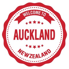 WELCOME TO AUCKLAND - NEW ZEALAND, words written on red stamp
