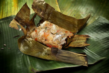 roasted fish, an indigenous Brazilian dish baked in a banana leaf