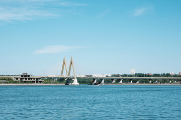 Obraz premium View of the Millennium Bridge from the Kazanka River embankment - Kazan, Russia, July 2021