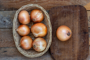big tasty onions on wooden table