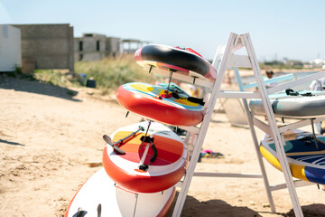 sup surf board rack shelf on the sea coastline vacation concept