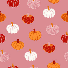 Autumn seamless pattern with colorful pumpkins on pink background