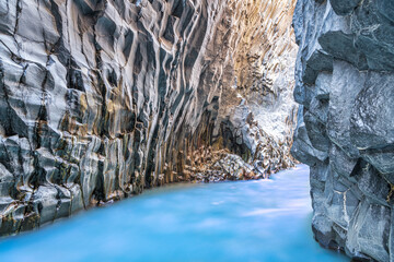 Alcantara river with beautiful lava stone walls in sicily, italy