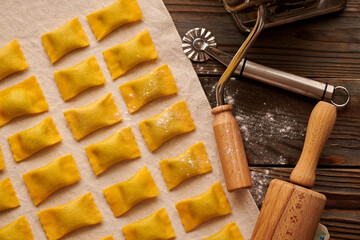 Fototapeta premium Raw homemade ravioli pasta with spinach and ricotta