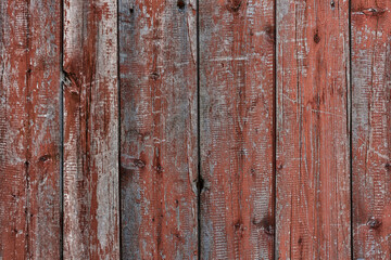 Fototapeta premium Old red brown weathered color planks. Painted wood texture. Vintage authentic painted wooden planks. Wood and oil paint. Country texture. Wallpaper. Material for designers and decorators.