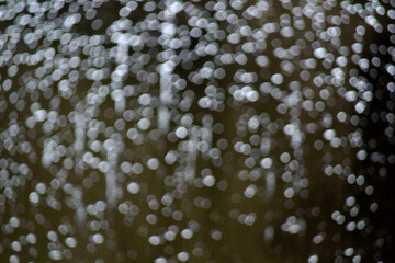 bokeh of water drops shower on the window 