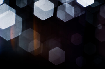 Abstract background image of bokeh formed by hexagonal shape blur lens.