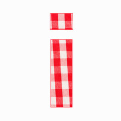 Fototapeta na wymiar Lowercase letter i of the alphabet - Red checkered fabric tablecloth