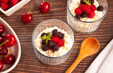 cottage cheese and yougurt with granola, berries and fruits apricot for healthy breakfast.