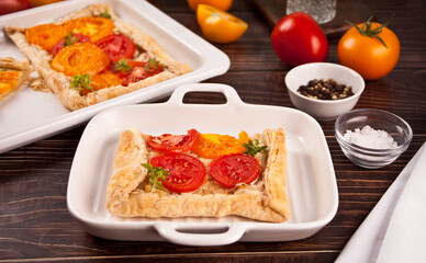 Tart puff pastry quiche with roasted tomatoes