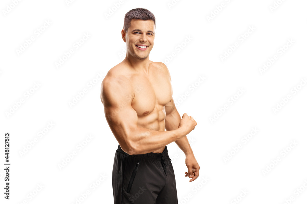 Poster Young smiling bodybuilder showing his arm muscle