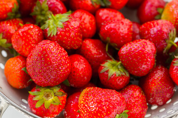 Fresh red ripe organic strawberry, close-up berry background. Healthy vegan food.