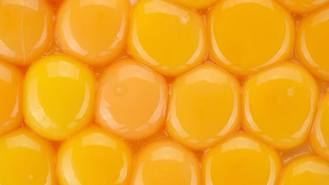 eggs yolks top view, rotation. yolks for making dough. Yolk for cooking. 4K UHD video 