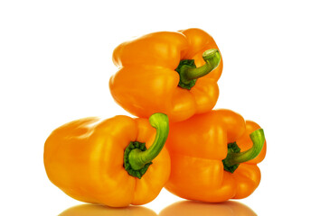 Three organic bell peppers, close-up, isolated on white.