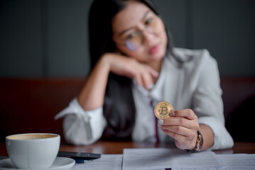 bitcoins - Bitcoin in hand of a casual businessman wondering what the future is