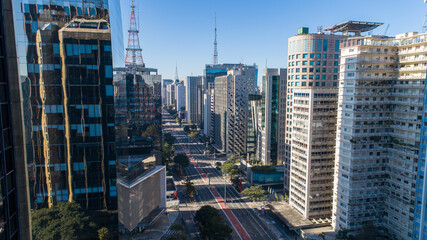 Fototapeta premium Aerial view of Av. Paulista in São Paulo, SP. Main avenue of the capital. Sunday day, without cars, with people walking on the street