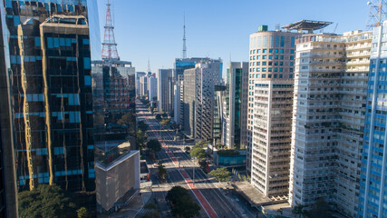Fototapeta na wymiar Aerial view of Av. Paulista in São Paulo, SP. Main avenue of the capital. Sunday day, without cars, with people walking on the street
