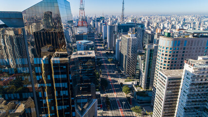 Fototapeta premium Aerial view of Av. Paulista in São Paulo, SP. Main avenue of the capital. Sunday day, without cars, with people walking on the street